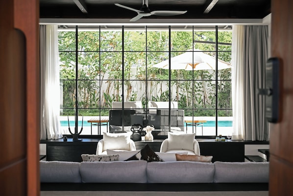 Luxury Villa | Living area | 50-inch TV with satellite channels - CARPEDIEM VILLA BALI operated by Villa Nila (Canggu)
