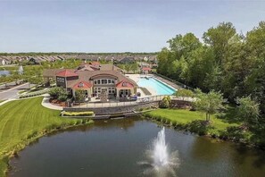 A large house with a swimming pool, a fountain, and a pond. - Bright & Spacious Millville Home (Millville)