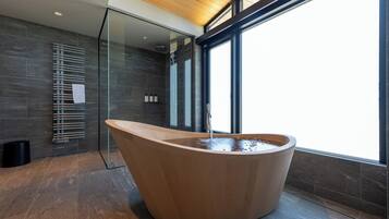 Separate tub and shower, rainfall showerhead, free toiletries