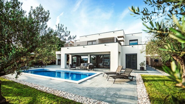 A modern two-story house with a swimming pool, outdoor seating, and a well-maintained garden. - Lovely home in Razanac (Razanac)