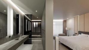 A modern hotel room with a large bed, a bathroom with a vanity, and a view of the cityscape. - Daegu Suseong The Arco Hotel Lions Park (Daegu)