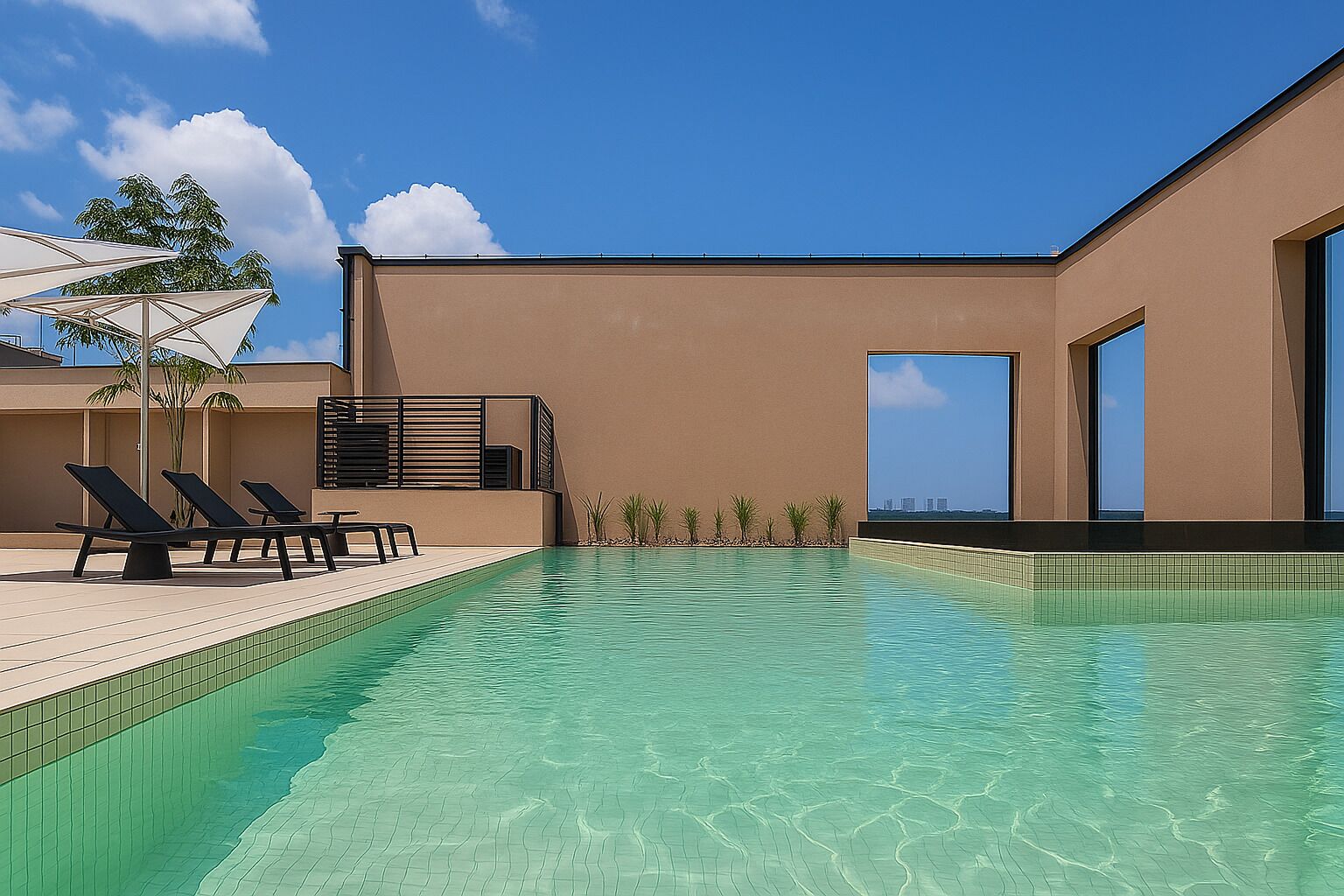 A modern pool area with clear water, lounge chairs, and a view of the city skyline.