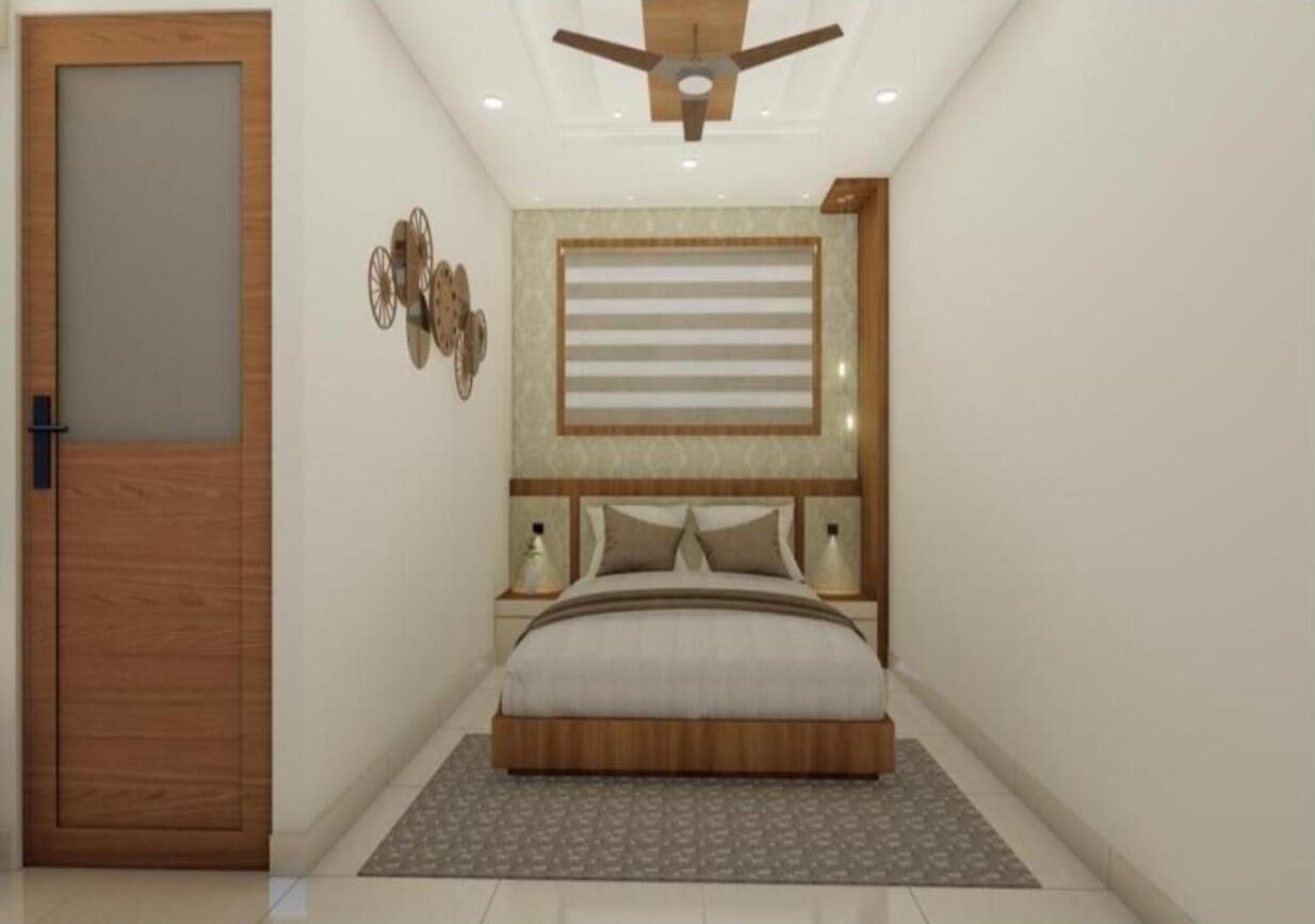 A bedroom with a wooden door, a ceiling fan, a bed with a headboard, bedside tables, and wall decor.