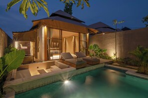 A modern villa with a pool, outdoor seating, and a well-lit interior. - Ubud Mas Glamping Luxury Tent (Mas)