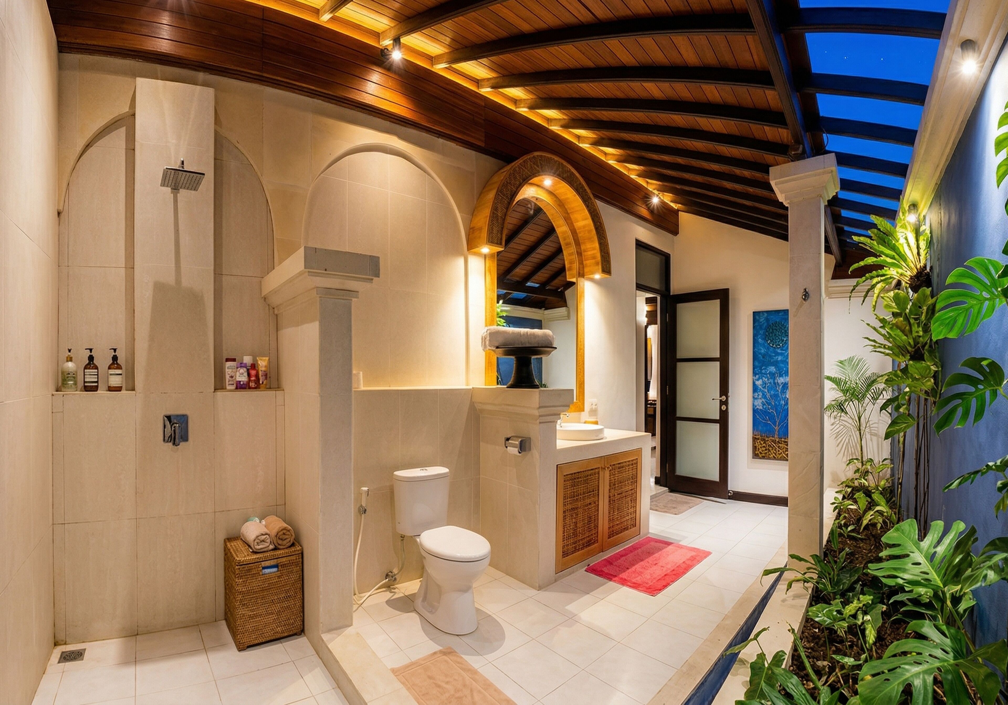 A modern bathroom with a shower, toilet, and sink, featuring wooden beams and tiled walls.
