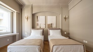 A hotel room with two beds, a large window, and a mirror. - Urban Elegance in Kolonaki 7min walk to Syntagma (Athina)
