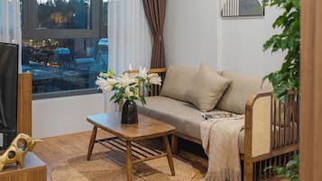 Senior Suite, 2 Bedrooms, Bathtub | Living area | 40-inch flat-screen TV with cable channels, DVD player, printers