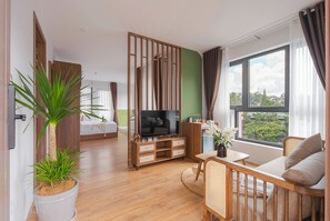 Senior Suite, 2 Bedrooms, Bathtub | Living area | 40-inch flat-screen TV with cable channels, DVD player, printers - Nature Hotel - Le Hong Phong (Da Lat)