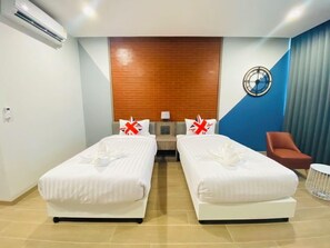 Habitación Deluxe con 2 camas individuales | 1 dormitorio, decoración individual, cortinas opacas y wifi gratis