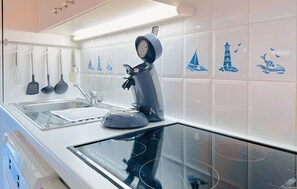 Fridge, stovetop, dishwasher, coffee/tea maker