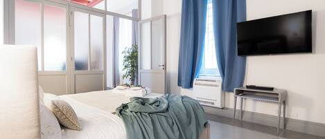 Departamento de lujo | 1 habitación, cortinas blackout y tabla de planchar con plancha