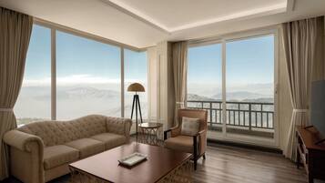 Luxury Suite, 1 Bedroom, Non Smoking, Mountain View | Living area | TV