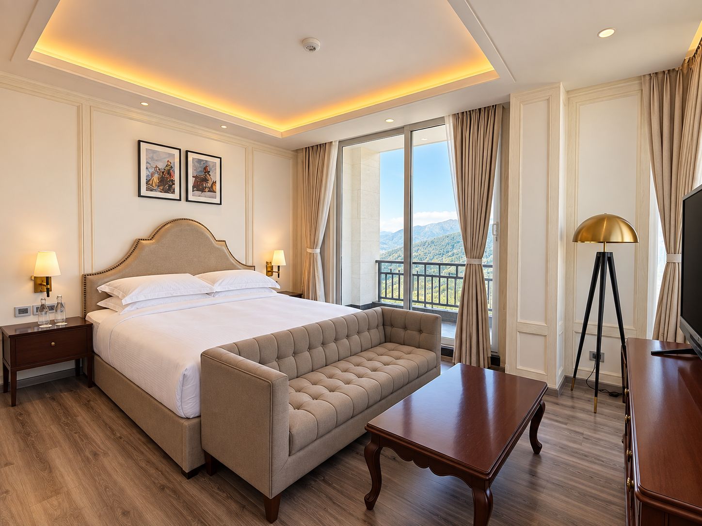 A hotel room with a large bed, a sofa, a TV, and a balcony with a view.