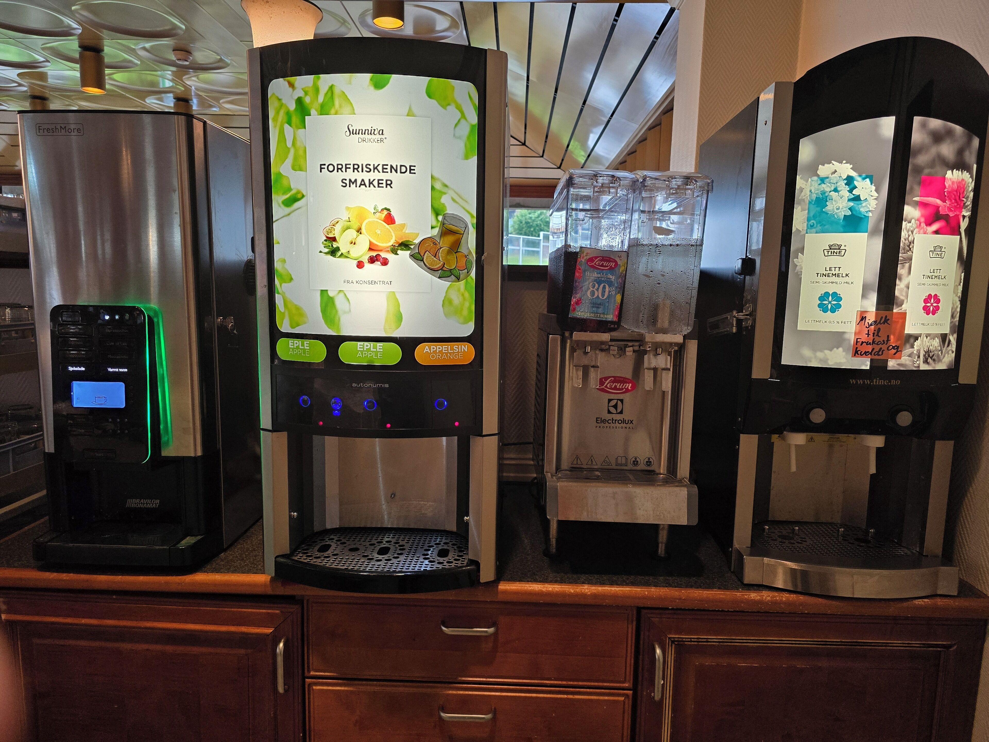 A coffee machine with a digital display and multiple beverage options.