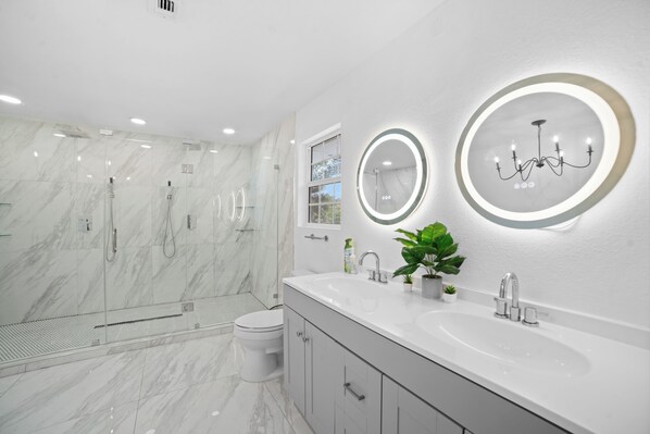 Shower, hair dryer, towels, soap