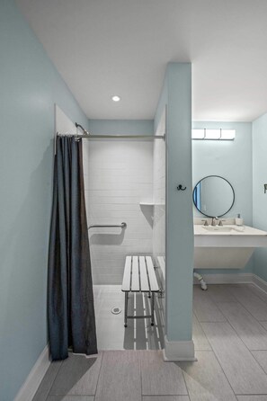 Shower, hair dryer, towels, shampoo