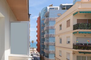 A multi-story building with balconies, a clear sky, and a view of the sea. - Montealba in Costa del Sol (Fuengirola)
