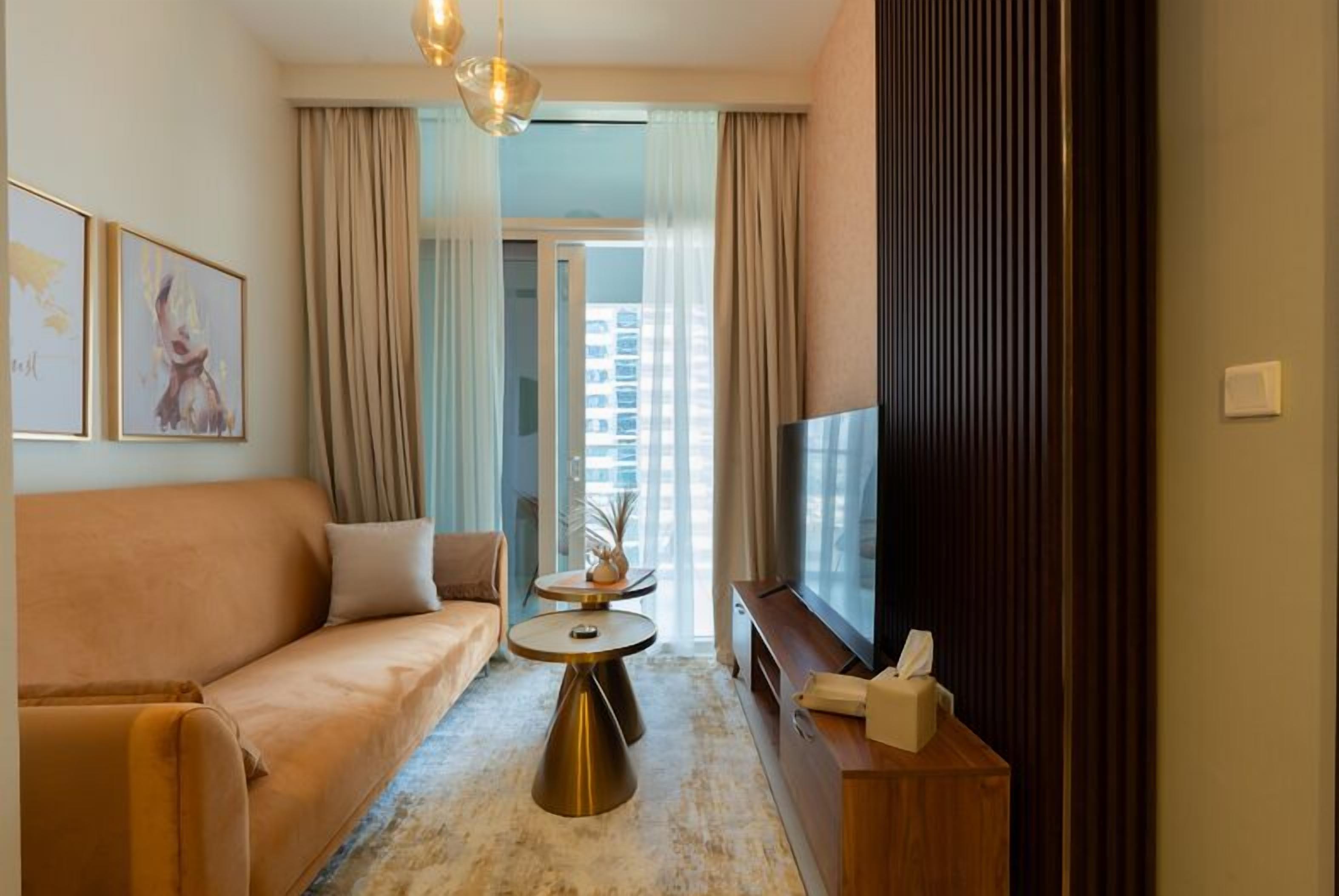 Deluxe Apartment, Balcony, Canal View | Living area | 65-inch flat-screen TV with digital channels