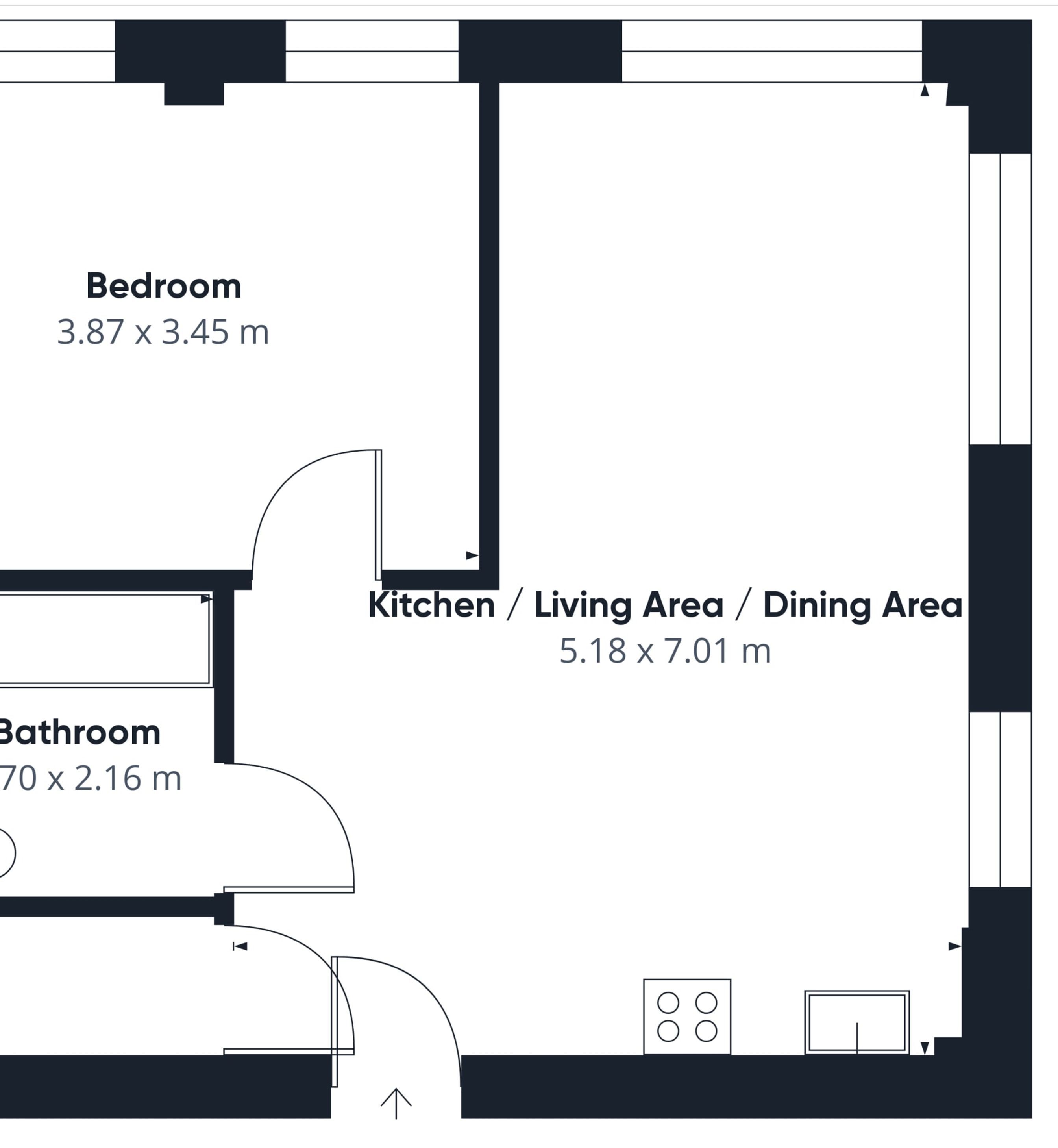 Pianta degli ambienti con una camera da letto (3,87 x 3,45 m), un bagno (70 x 2,16 m) e una zona cucina/sala da pranzo (5,18 x 7,01 m).