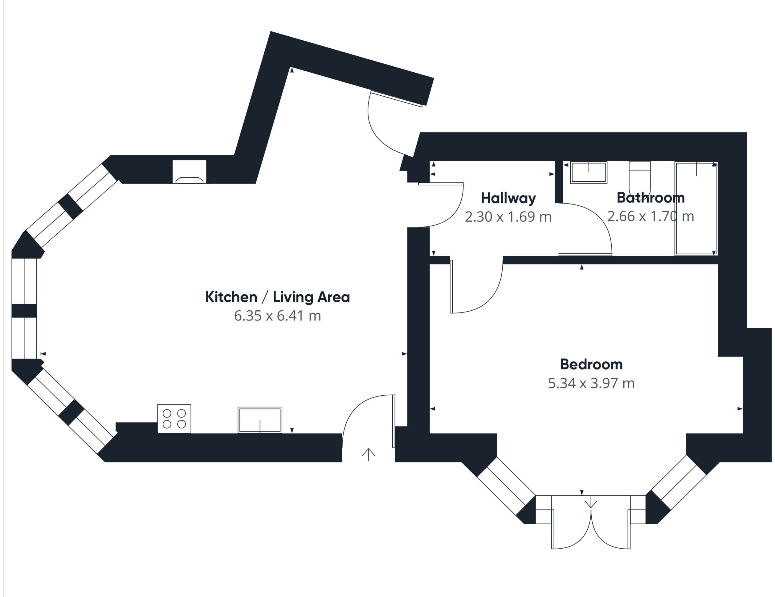 A floor plan with a kitchen/living area, hallway, bathroom, and bedroom.