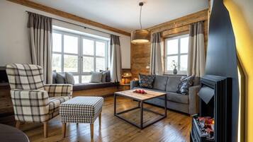 Deluxe Suite, Balcony | Living area | 50-inch flat-screen TV with satellite channels, ping pong, books