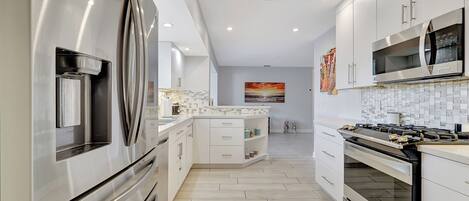 House, Multiple Beds, Pool Access, Pool View (Waterfront Villa) | Private kitchen | Fridge, microwave, oven, stovetop