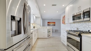 House, Multiple Beds, Pool Access, Pool View (Waterfront Villa) | Private kitchen | Fridge, microwave, oven, stovetop