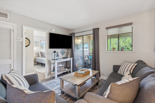 Condo, Multiple Beds, Balcony, Garden View (Seaside Bliss Retreat) | Living area | 42-inch flat-screen TV with digital channels