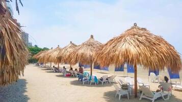 Private beach, sun loungers, beach umbrellas, beach volleyball