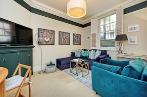 Apartment (1 Bedroom) | Living area | 32-inch Smart TV with digital channels, TV