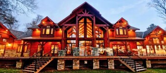 Beautiful Custom Log Home nestled on 300 ft beach front 