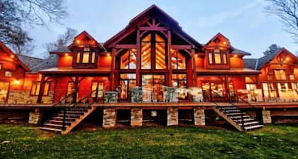 Beautiful Custom Log Home nestled on 300 ft beach front
