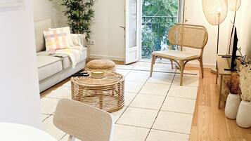 Deluxe Duplex, City View | Living area | 40-inch Smart TV with cable channels, Netflix, streaming services