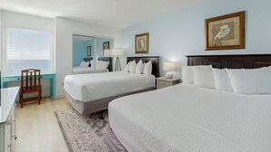 A hotel room with two beds, a desk, a chair, and a large mirror. - Fully updated 2025 Dream Oceanfront Sunset View. 2/2 Sleeps 8 (Fort Walton Beach)