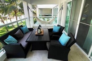 Outdoor dining - Sunny Caribbean Apartment with Pool (Punta Cana)