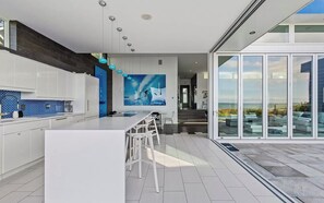 Fridge, microwave, oven, stovetop - Stunning Water Front 4 bedroom - 60 Feet of Nano style windows open to NorthFork (Hampton Bays)