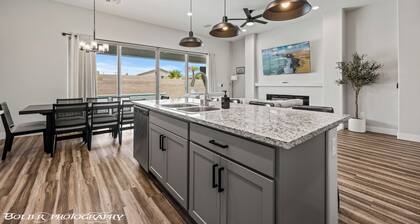 Game Room • Heated Pool & Spa • Fire Pit • Putting Green • Outdoor TV