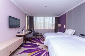 A hotel room with two beds, a desk, a chair, a TV, and a large window. - LAVANDE HOTELS Guangzhou Zengchen Xintang Light Rail Metro Station (Guangzhou)