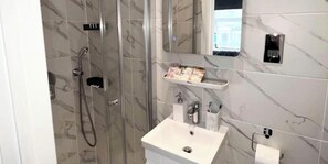 Shower, hair dryer, soap, shampoo