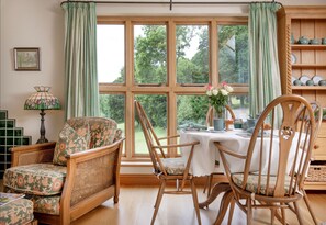The dining area offers views over the impressive 10 acre grounds - Branscombe Lodge is nestled in a serene wooded valley (Branscombe)