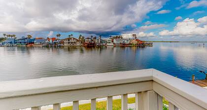 Water-view condo with docks, outdoor pool, near attractions