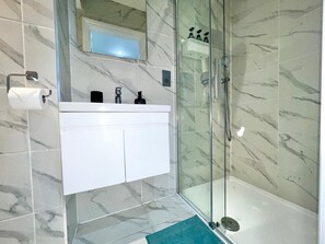 Shower, hair dryer, towels, soap