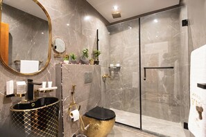Luxury Suite, Balcony, Mountain View | Bathroom | Hair dryer, slippers, towels, soap