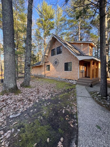 Private boat dock with easy access to Torch Lake sandbar! 