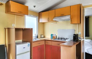 Fridge, stovetop, coffee/tea maker, cookware/dishes/utensils