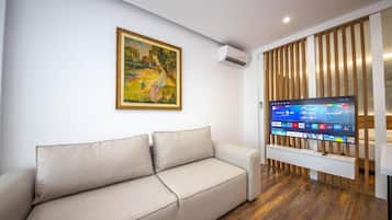 Red Vip Premium Studio | Living area | 40-cm Smart TV with cable channels