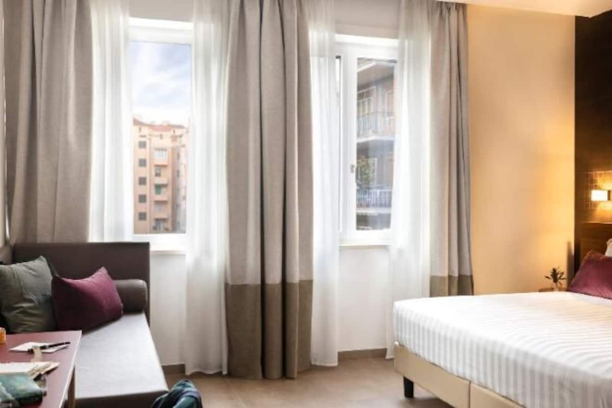 Premium bedding, down comforters, memory foam beds, in-room safe