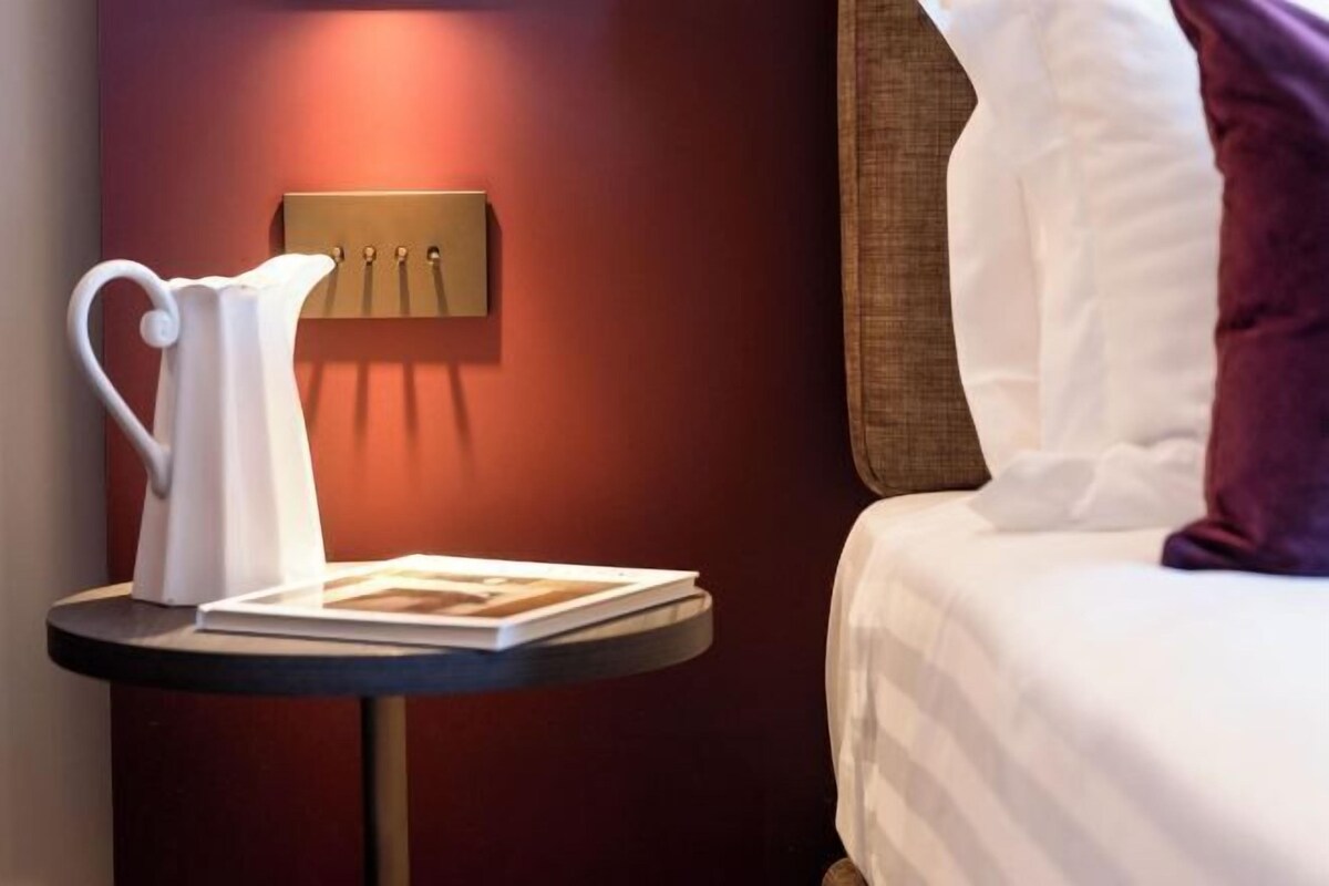 Premium bedding, down comforters, memory foam beds, in-room safe