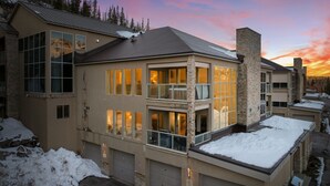 A multi-story building with large windows, stone accents, and a garage. - 3min Walk to Ski Lift*Hot Tub*Epic Kids Room*Views (Brian Head)