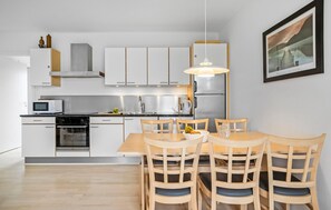 Fridge, stovetop, dishwasher, coffee/tea maker